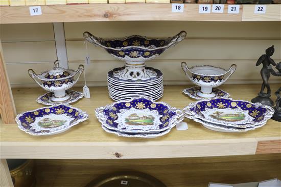 A Staffordshire dessert service, decorated in cobalt blue and gilt and painted topographical scenes